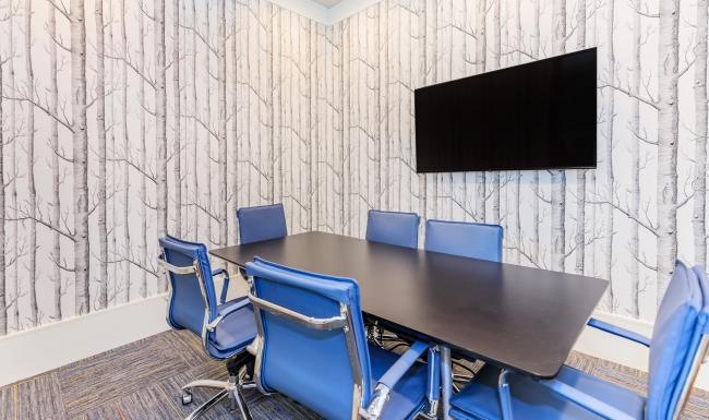 Take advantage of all Wyldewood Gosling has to offer a table with chairs around it in a meeting room