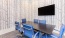 a table with chairs around it in a meeting room